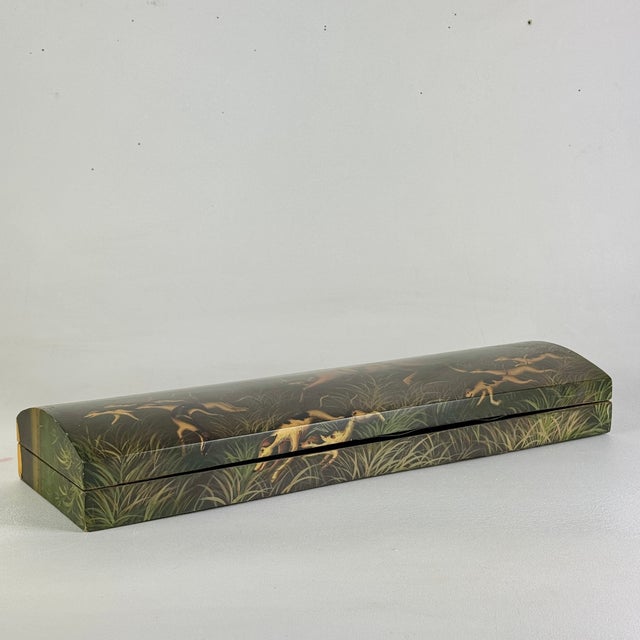 This feels very European, though we found it in the United States. An unusually elongated keepsake box made of wood and...