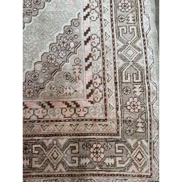 Experience the timeless elegance of this 19th-century Antique Samarkand Rug, measuring 12.6' x 6.4'. Its intricate designs...