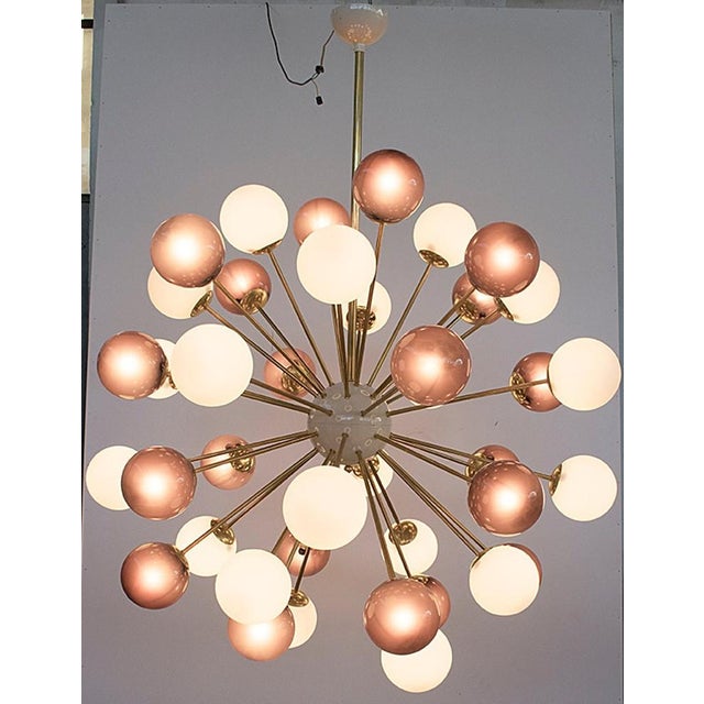 Italian sputnik chandelier with 40 Murano glass globes in frosted amethyst and matte white colors, mounted on brass frame...