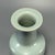 This elegant antique vase is crafted in classic Chinese Longquan celadon. It features a flat flared rim, tall slender neck...