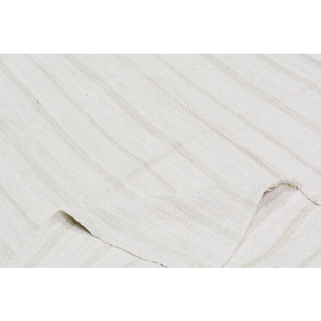 Flatweaved with care using traditional rug-making techniques, this wool rug blends timeless craftsmanship with a modern...