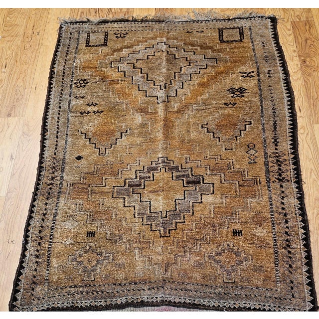 This vintage Moroccan camel hair area rug from the third quarter of the 20th century is a piece of timeless, meditative...