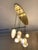 Mouth-blown glass pendants with 10 lights on a brass finish oval canopy. Inspired by the "Vallons Obscurs" of the Var...