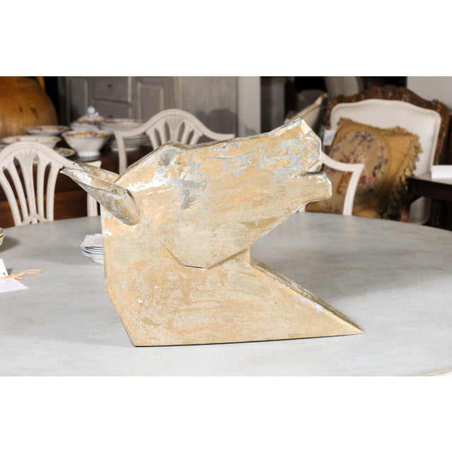 A French gilded zinc horse head sculpture from the late 19th century, with stylized character and distressed patina....
