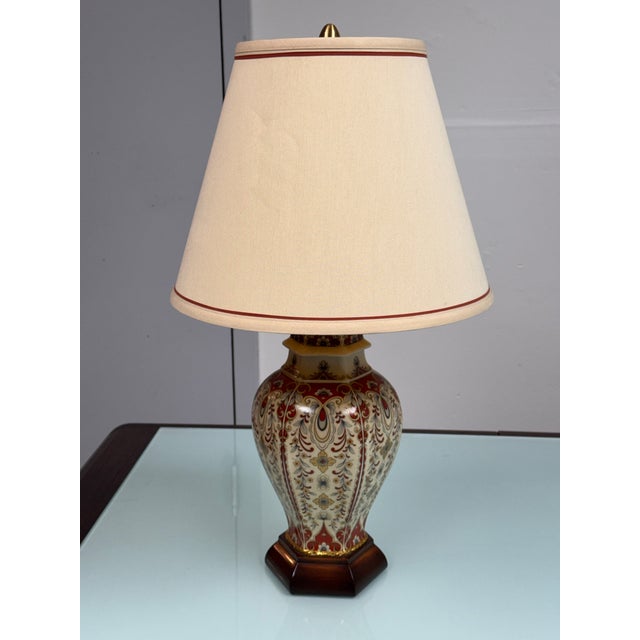 Design Plus Gallery presents the Vintage Ornate Porcelain Urn Table Lamp. The urn-shaped porcelain body is decorated with...