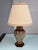 Design Plus Gallery presents the Vintage Ornate Porcelain Urn Table Lamp. The urn-shaped porcelain body is decorated with...