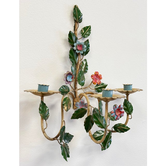 Vintage Italian vibrantly colored Tole metal candle sconce. Features painted meta vines and leaves with blue and red...