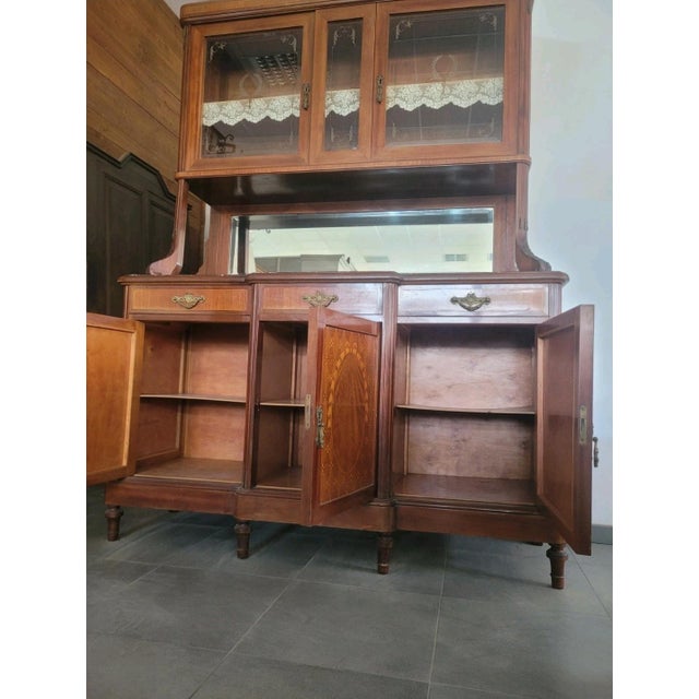 Elegant double-body inlaid sideboard with a marble top. Dating back to the first half of the 20th century, it is in good...