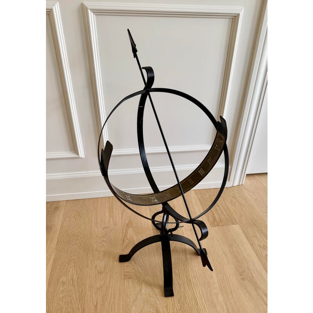 A beautifully crafted, late 20th Centuru iron armillary half-sphere, evoking the timeless elegance of classical European...