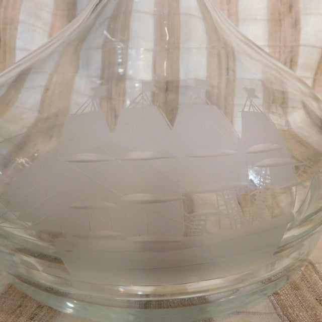 This is a large and very pretty ships decanter with an etched ship on one side. The decanter is clear with a flat bottom,...