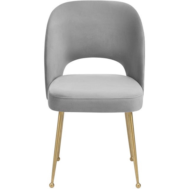 The Swell dining chair offers the perfect blend of Mid Century Modern and Hollywood Glam. With sumptuous velvet upholstery...