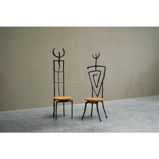 Exceptional pair of brutalist giacometti style accent chairs in iron and beech, 1980s - 1990s. This is a very special...