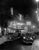Street Night 29th September 1954: A bus and cars travelling down Shaftesbury Avenue, London, in front of an illuminated...