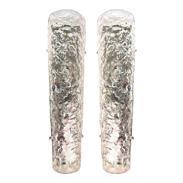 Contemporary luxury modern wall sconces made in transparent hammered murano glass. set of two impressive pieces in chromed...