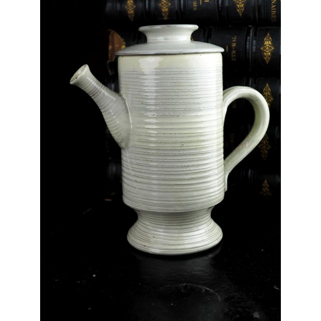 Cream stoneware coffee jug with a typical Scandinavian silhouette. This vintage coffee maker can fit into many...