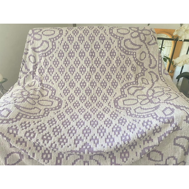 This charming vintage 50s chenille bedspread is a rare gem, featuring a soft amethyst background (likely cotton) with...