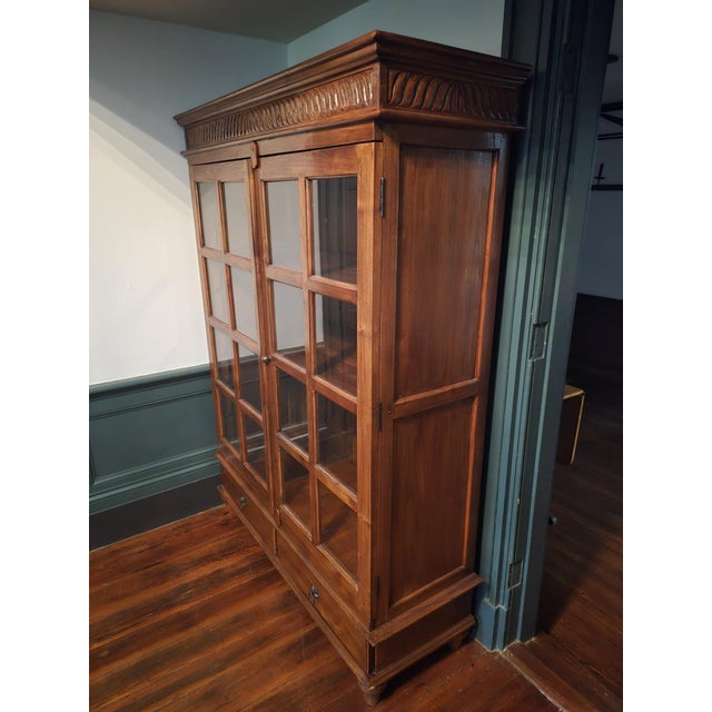 Elevate your interior with this elegant Arhaus oak display cabinet, a perfect blend of traditional craftsmanship and...