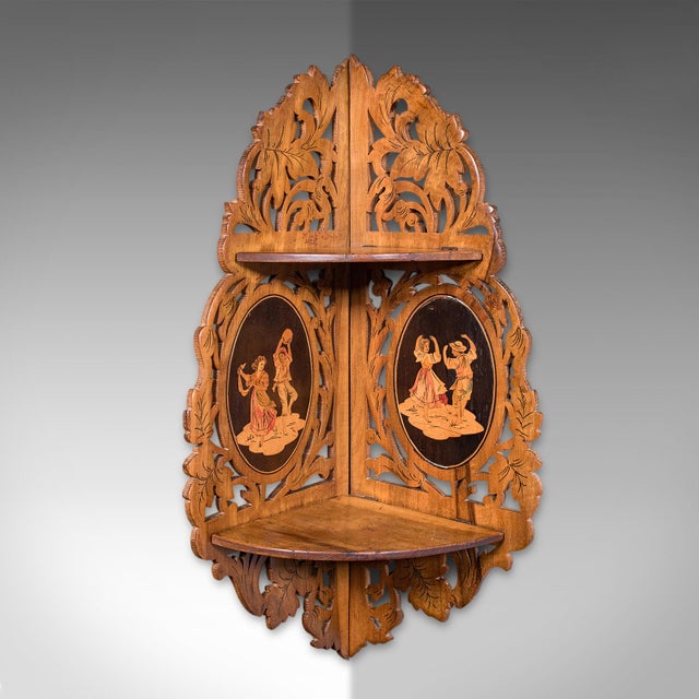 This is an antique Sorrentoware corner display shelf. An Italian, golden walnut fretwork shelving bracket or whatnot,...