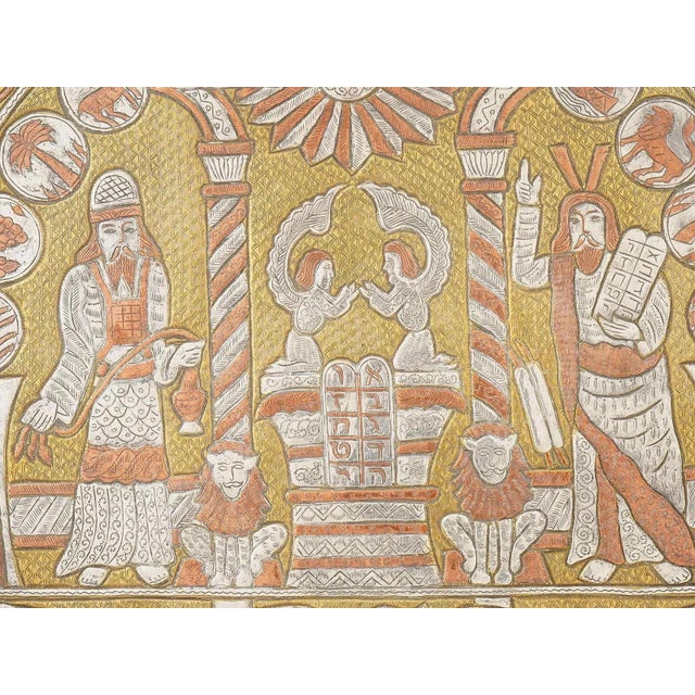 An antique Judaica brass tray inlaid with silver and copper. Round in shape with elevated rims. The piece is richly...