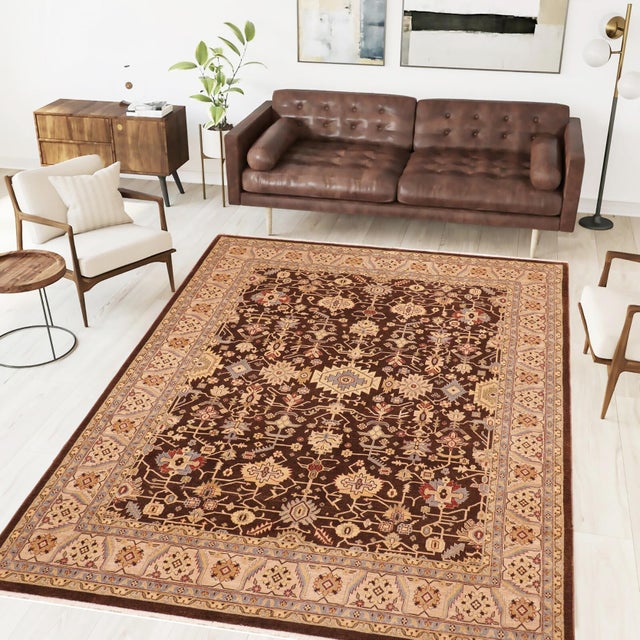 Enhance the ambiance of your home with this magnificent Persian-influenced Turkish hand-knotted rug made by skilled...