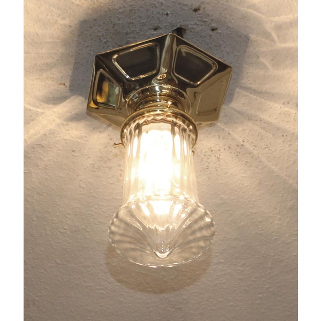 Art Nouveau Ceiling Lamp Art Nouveau ceiling lamp, circa 1915. Geometrically embossed brass body. Original clear glass...