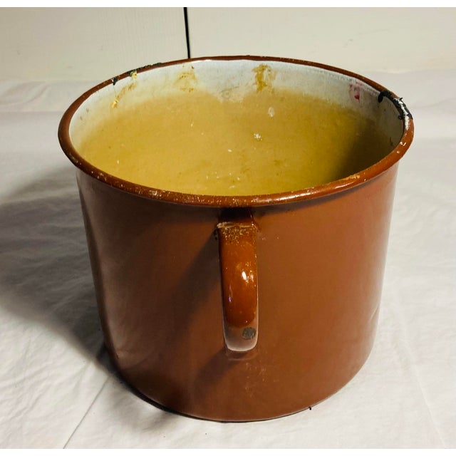Large enamelware pot used in Artist study for storage of art utensils for plants flowers or kitchen display probably from...