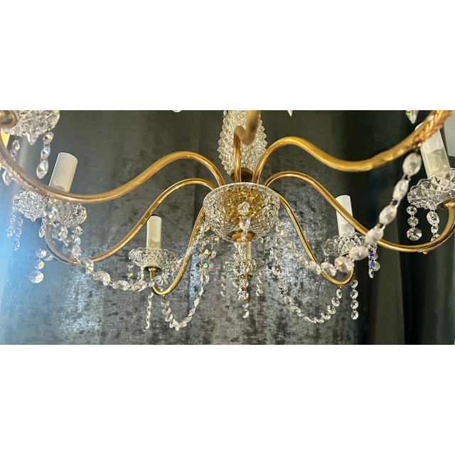 "An absolutely stunning large mid 20th century French brass and crystal chandelier in the style of Maison Bagues from the...