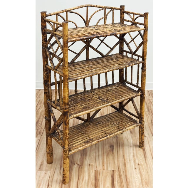 Stunning and substantial four tier wood and bamboo bookshelf. Features a Chinoiserie style look with a scorched bamboo...
