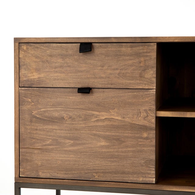 Inspired by clean midcentury design, a modular filing credenza of greyish auburn poplar brings roomy storage space to the...