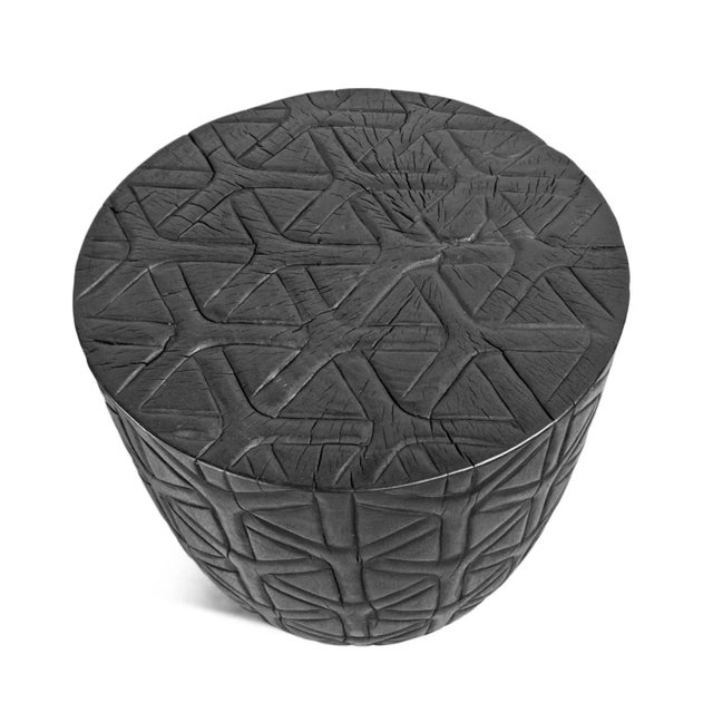 Solid acacia wood stump stool / side table with rich ebony stain and hand carved cane pattern surface. Wonderful unique...