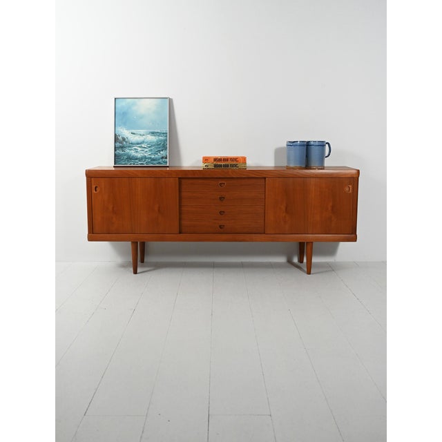 Elegant 1960s danish teak sideboard by h. W. Klein with sliding doors, central drawers, and carved handles. made in...