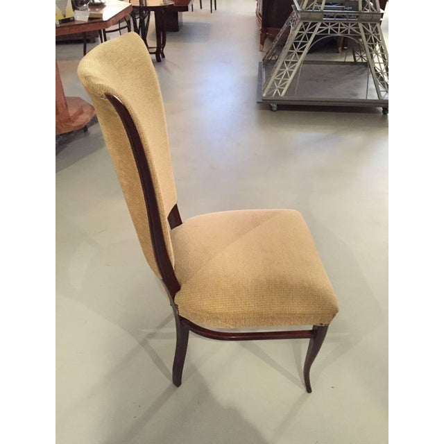 Fabulous pair of mahogany French Art Deco side chairs from the 1930s. The mahogany legs, tapering rear legs and an...