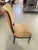 Fabulous pair of mahogany French Art Deco side chairs from the 1930s. The mahogany legs, tapering rear legs and an...