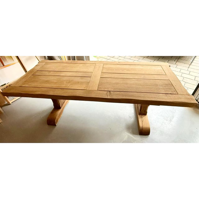 A true statement of European craftsmanship and timeless design. This authentic early 1900s Belgian oak monastery trestle...
