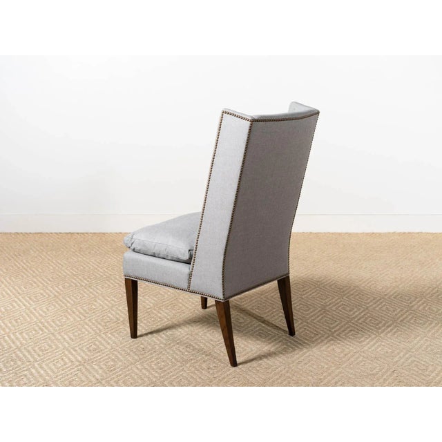 Upholstered high back host chair Fabric: Gray Black-100% Sunbrella Acrylic Narrow wing extensions and loose seat cushion...