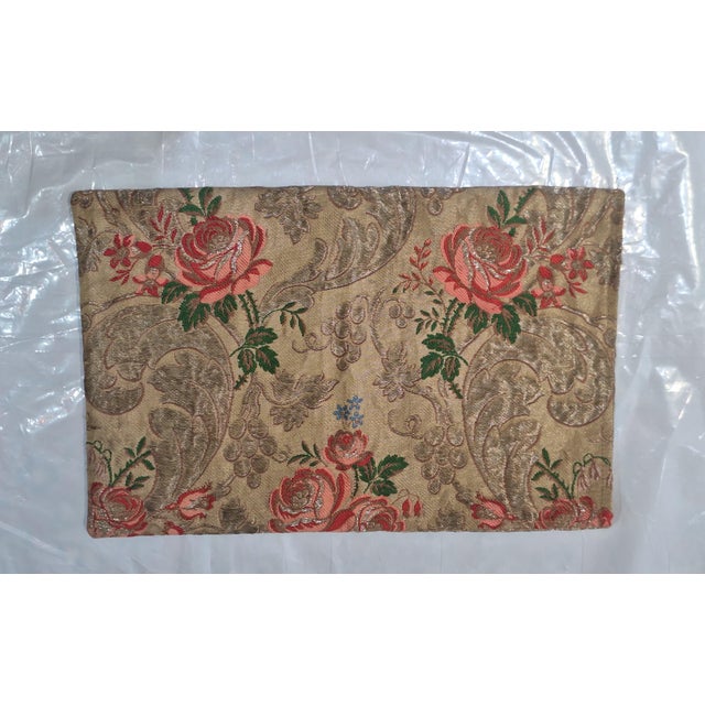 Elegant decorative pillow cover crafted from richly textured brocade fabric featuring a warm gold background with woven...