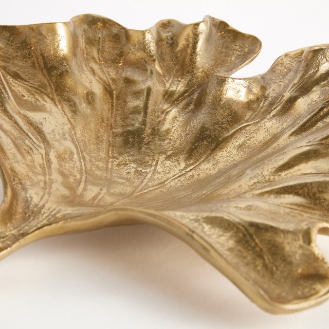 A traditional method of sand casting by hand is what creates the natural leaf details. Made of aluminum, this substantial...