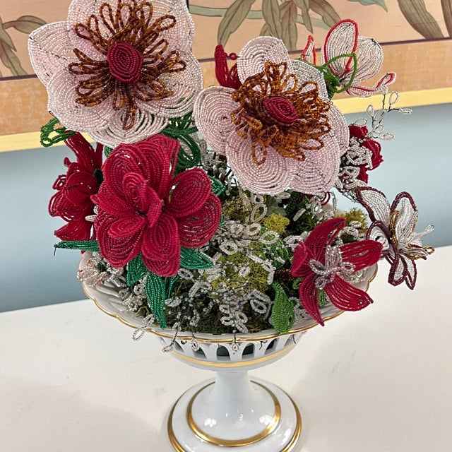 This is a gorgeous porcelain compote that has been made even more stunning with a collection of large French seed-bead...