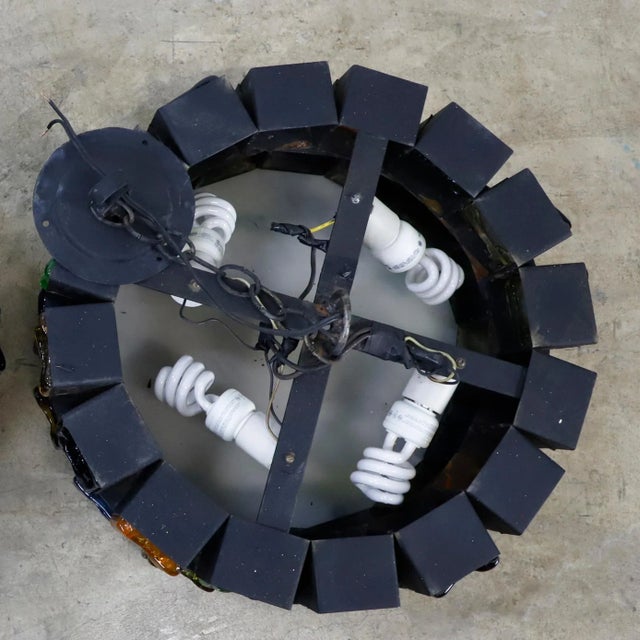 This chandelier is one of the most stunning samples of Brutalist art, made of steel and multicolored blown glass, each...