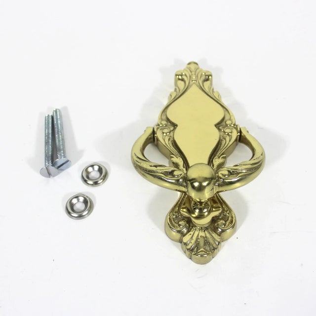 Vintage brass door knocker. Includes hardware. This is old, but never used. I removed it from the original packaging to...