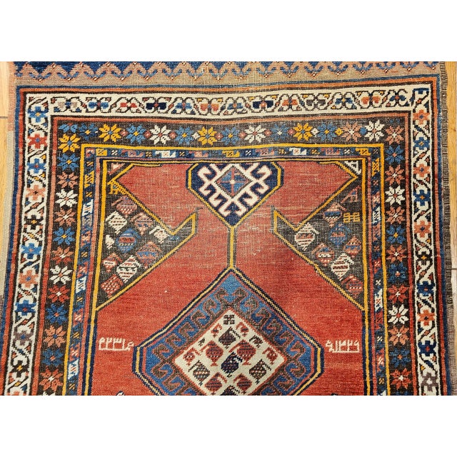 Vintage Persian Kurdish Bidjar runner, meticulously hand-knotted in the early 1900s. Originating from the skilled Kurdish...