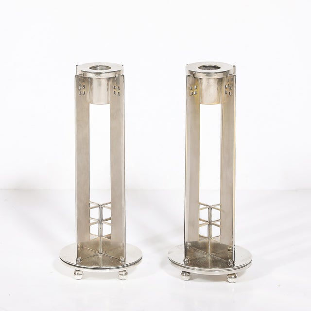 This Modernist pair of silver-plated candlestick holders by Swid Powell, designed by the renowned architect Robert A. M....