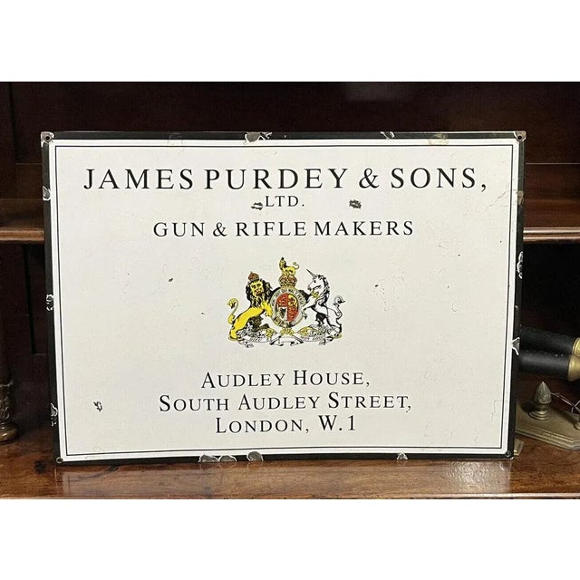James Purdey & Sons Enamel Sign. This a heavy and good Quality reproduction enamel sign. Sizes :- 60 x 42 cms.