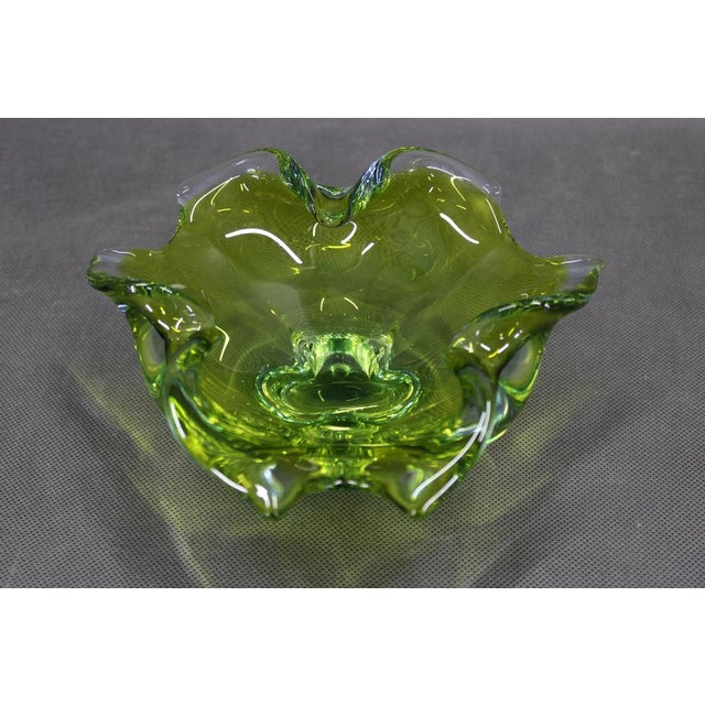 A refined mid-century modern glass bowl designed by Josef Michal Hospodka, produced in Czechoslovakia in the 1970s....