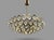 Striking 1960s chandelier with a sculptural radial form, combining faceted glass elements and a brass structure for a...