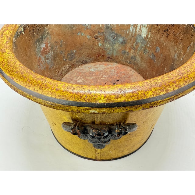 This exceptional 19th-century French tole peinte cachepot is a masterful example of neoclassical decorative art,...