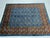 This beautiful blue Turkmen tribal rug features a traditional Mori Gul geometric design with repeating motifs across a...