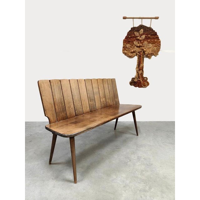 Beautiful in its simplicity\. this vintage wooden bench from the 1960s. with its robust design, wooden panels, and organic...