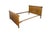 An antique Late Victorian Empire inspired sleigh bed frame. Crafted from quartersawn oak, displaying a heavily figured...