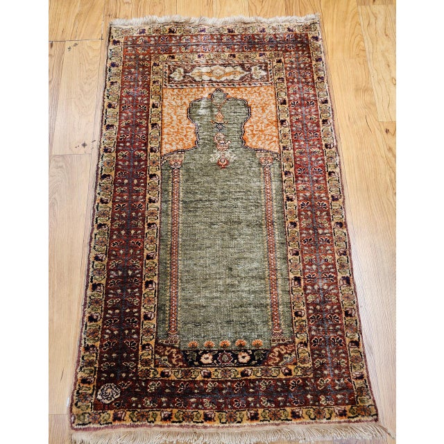 This exquisite Turkish silk prayer rug is a superb example of the refined artistry for which Hereke weavers are...